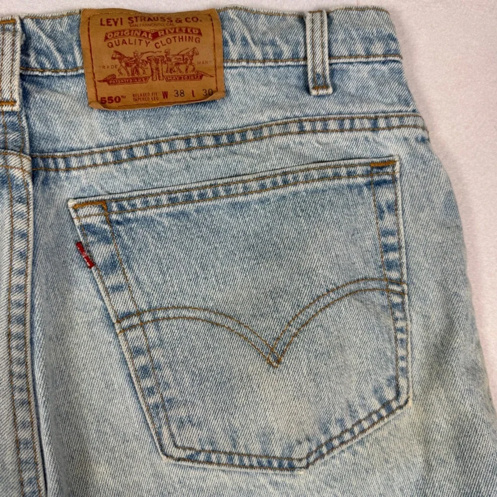 Vintage 90s Levis 550 Relaxed Fit Tapered Jeans Light Wash 38x28 Made in USA